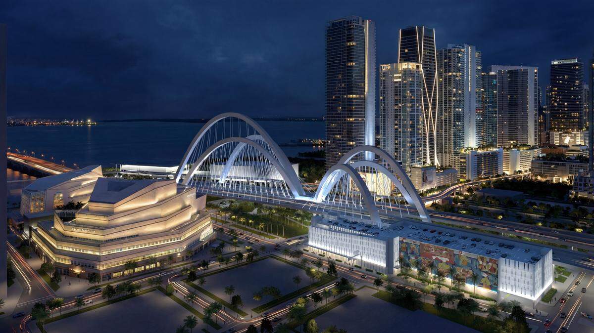 A rendering depicts a proposed public parking garage, illuminated at right, for the Arsht Center for the Performing Arts. The Arsht’s Ziff Ballet Opera House is at left, and the arches for the still-unfinished Interstate 395 signature bridge are at center. A rendering depicts a proposed public parking garage, illuminated at right, for the Arsht Center for the Performing Arts. The Arsht’s Ziff Ballet Opera House is at left, and the arches for the still-unfinished Interstate 395 signature bridge are at center.